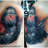 Stunning looking colored shoulder tattoo of mystical soldier in gas mask