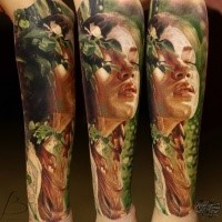 Stunning multicolored leg tattoo of sweet girl portrait with plants