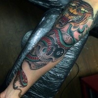 Stunning multicolored sleeve tattoo of snake with tiger