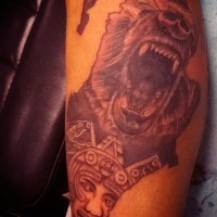 Stunning natural looking black and white roaring bear tattoo combined with Mayan tablet