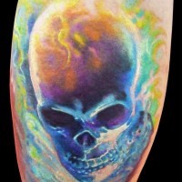 Stunning painted and colored big burning skull tattoo on leg