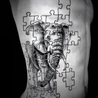 Stunning puzzle shaped black ink side creative tattoo stylized with elephant