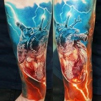 Stunning realism style colored forearm tattoo of human heart and lightning
