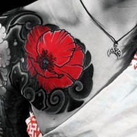 Stunning red colored little flower tattoo on chest