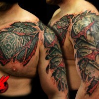 Stunning under skin style colored shoulder and chest tattoo of medieval armor with lion emblem