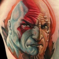 Stunning very realistic colored evil tribal man portrait on thigh tattoo
