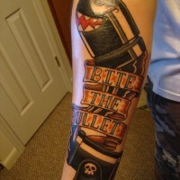 Stunning video game like colored bullet tattoo on forearm combined with lettering