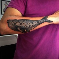 Stylized black sea whale tattoo