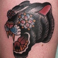 Stylized head of a black panther tattoo