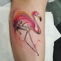 Stylized pink flamingo with lettering tattoo on calf in watercolor style