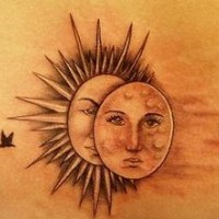 Sun and moon with birds tattoo on lower back