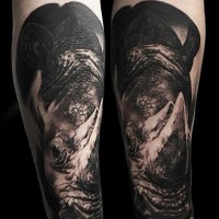 Super detailed 3D lifelike rhinoceros forearm tattoo in dark colors