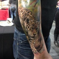 Super realistic leopard tattoo on whole arm