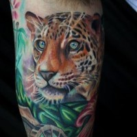 Super realistic leopard head tattoo on arm by Dave Wah