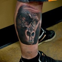 Super realistic portrait of a gorilla tattoo on leg