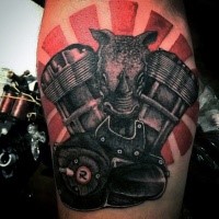 Superior colored bike engine with rhino head tattoo on arm
