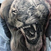 Superior detailed whole back tattoo of lion head with big teeth