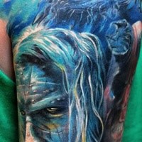 Superior multicolored shoulder tattoo of mystical man face with feather