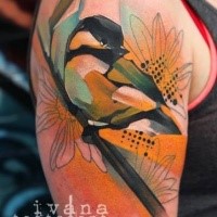 Superior watercolor like colored shoulder tattoo of bird on tree branch