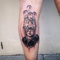 Surrealism style black ink leg tattoo of human face covered with burning candles
