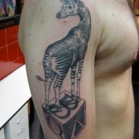Surrealism style black ink shoulder tattoo of unbelievable animal with cube