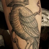 Surrealism style black ink thigh tattoo of bird with TV instead of head