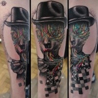 Surrealism style colored arm tattoo of mystical face with hat