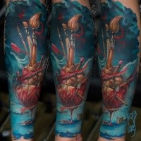 Surrealism style colored forearm tattoo of human heart with various brushes