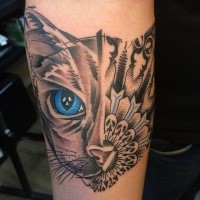 Surrealism style colored forearm tattoo of half cat half mask