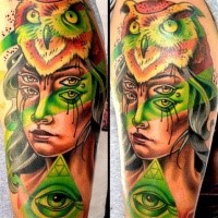 Surrealism style colored shoulder tattoo of mystical woman with owl helmet