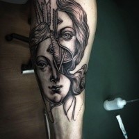 Surrealism style detailed forearm tattoo of divided woman face with arrows