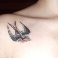 Swallow bird tattoo under collarbone for female