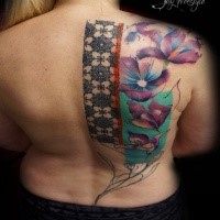 Sweet looking colored back tattoo of large flowers and ornaments