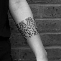 Sweet looking dot style forearm tattoo of interesting ornament