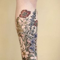 Sweet multicolored big various flowers tattoo on leg