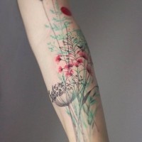 Sweet painted and colored field flowers tattoo on arm