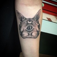 Symmetrical dot style forearm tattoo of mysterious cat with moon symbol