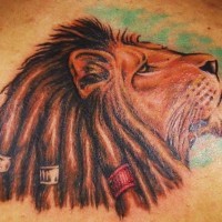 Lion of zion with dreads coloured tattoo