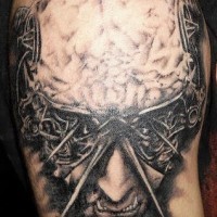 Surreal art brains out tattoo on shoulder