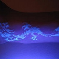 Glowing dragon uv ink tattoo