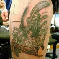 Xenomorph killing man tattoo