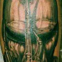 Alien creature face tattoo
