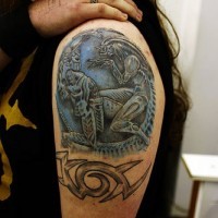 Alien versus predator tattoo on shoulder