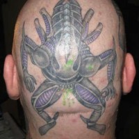 Creepy xenomorph on head tattoo