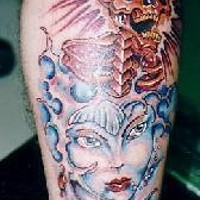 Otherwold girl and skull coloured tattoo