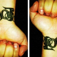 Ambigram text love and hate on wrist