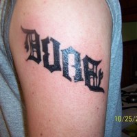 Ambigram tattoo on shoulder