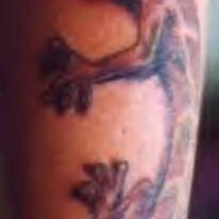 Crawling lizard realistic tattoo