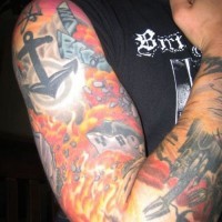 Full sleeve coloured tattoo with flames sputnik and anchor