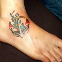 Coloured anchor with flowers tattoo on ankle